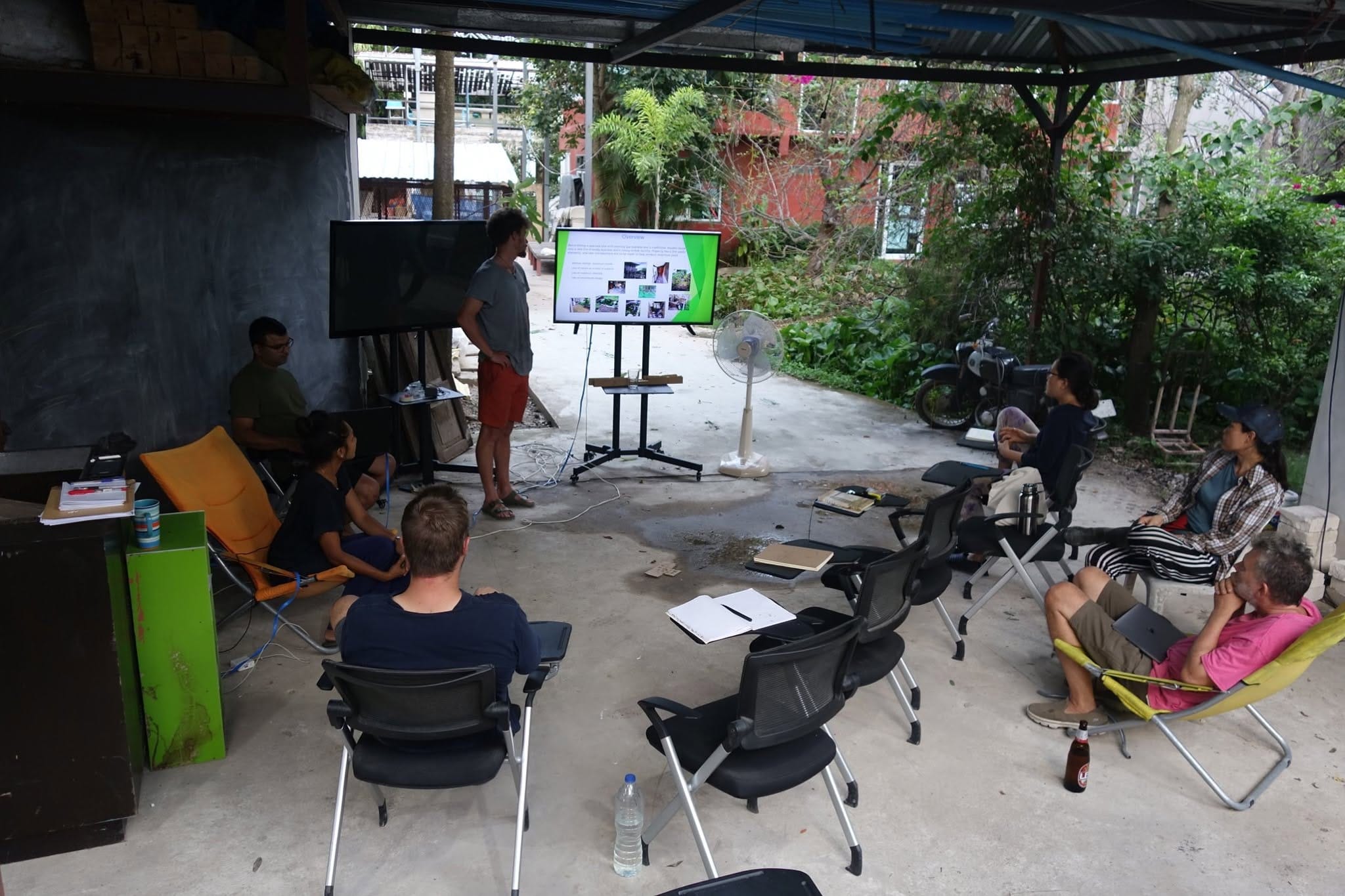 Instructor presenting to permaculture students in an outdoor classroom at Daruma Eco Farm